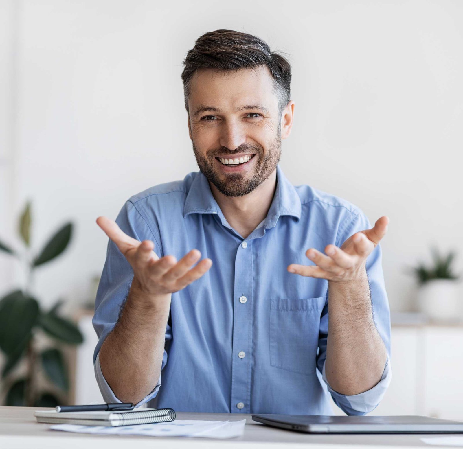 Home 2 10 successful handsome businessman sitting at desk in 2022 12 16 07 48 48 utc 2